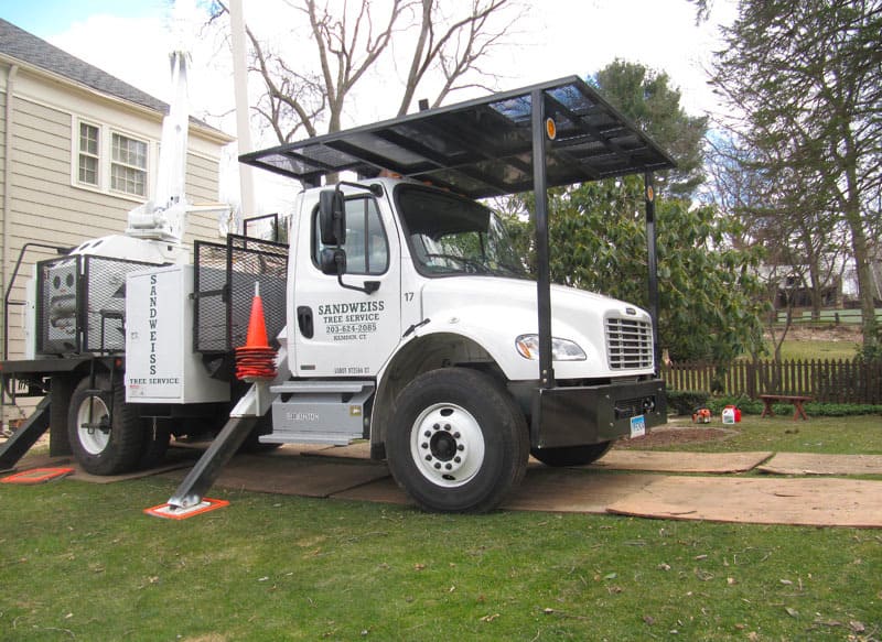 Sandweiss Tree Service vehicle at the work location